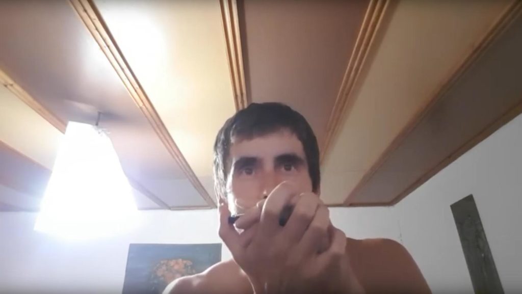 me playing the harmonica